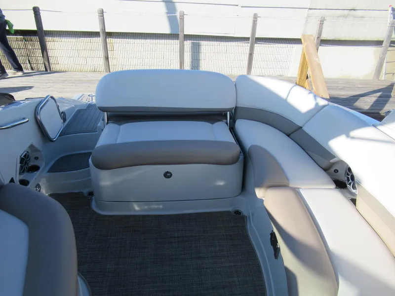 Slide: The Image of 2019 Crownline 285SS boat interior with beige and white seating arrangement. - 24