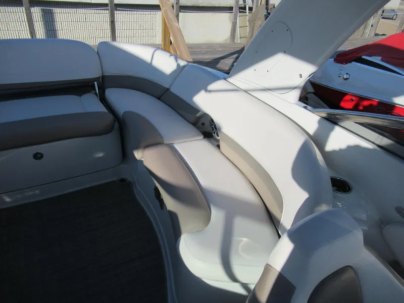 Slide: The Image of 2019 Crownline 285SS boat interior with white and gray seating. - 25