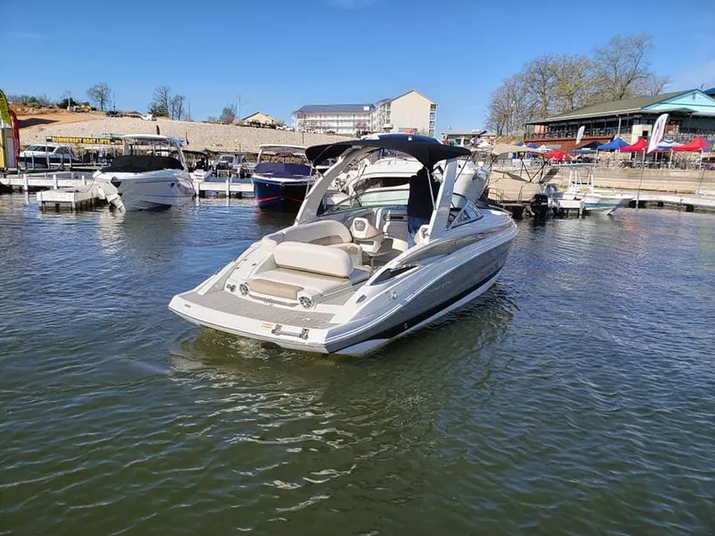 Slide: The Image of 2019 Crownline 285SS boat docked at a marina on a sunny day. - 3