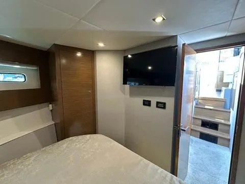 Slide: The Image of 2018 Cruisers Yachts 42 Cantius bedroom interior with TV and modern design. - 10
