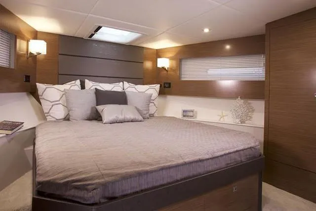 Slide: The Image of Luxurious bedroom interior of 2018 Cruisers Yachts 42 Cantius with modern decor and ambient lighting. - 46