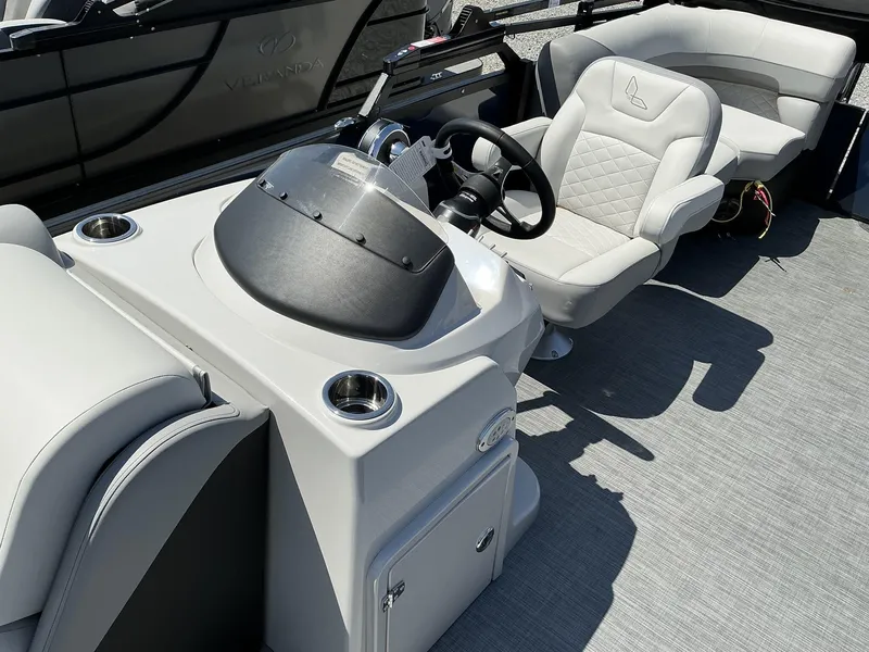 Slide: The Image of 2025 Lowe SS230 boat interior with modern steering console and comfortable seating. - 7