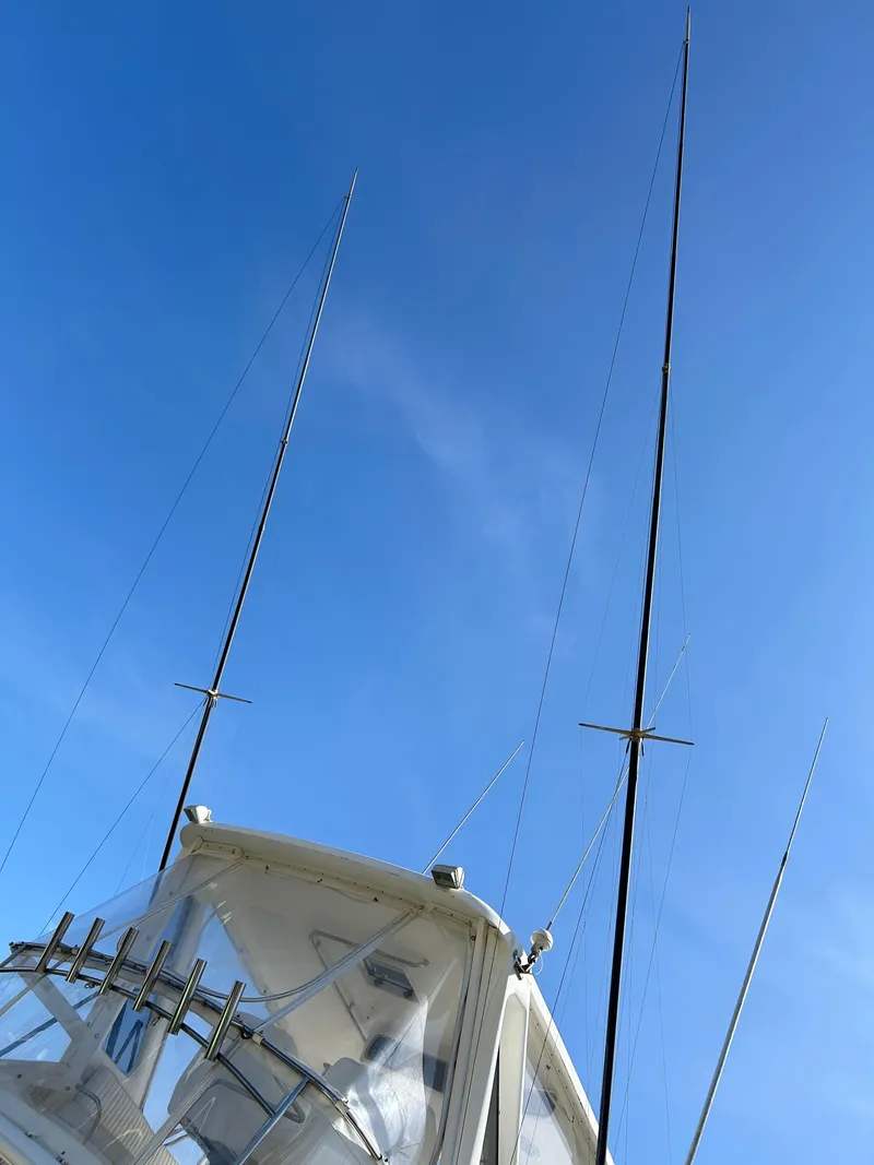Slide: The Image of 1995 Ocean Yachts 42 Super Sport with antennas against a clear blue sky. - 11