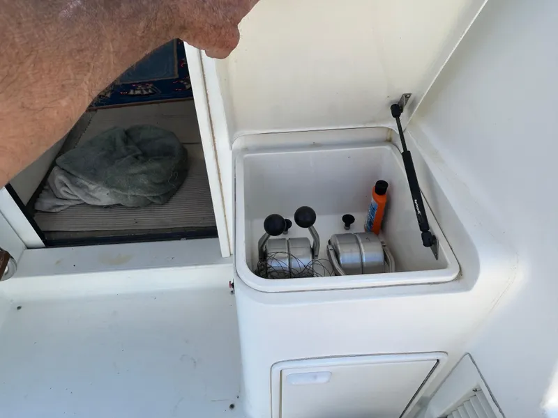 Slide: The Image of Open storage compartment on 1995 Ocean Yachts 42 Super Sport boat deck. - 16