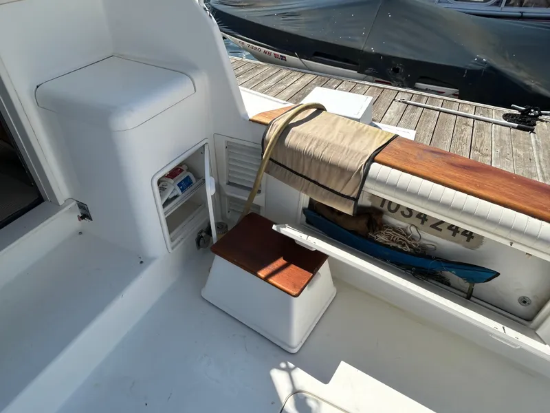 Slide: The Image of 1995 Ocean Yachts 42 Super Sport boat deck with storage and seating area. - 18