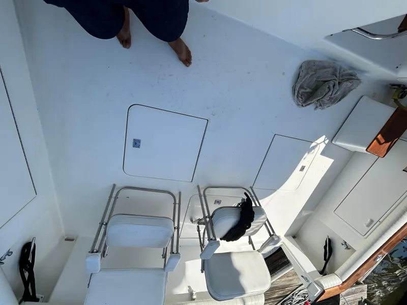 Slide: The Image of 1995 Ocean Yachts 42 Super Sport deck with chairs and storage compartments. - 21