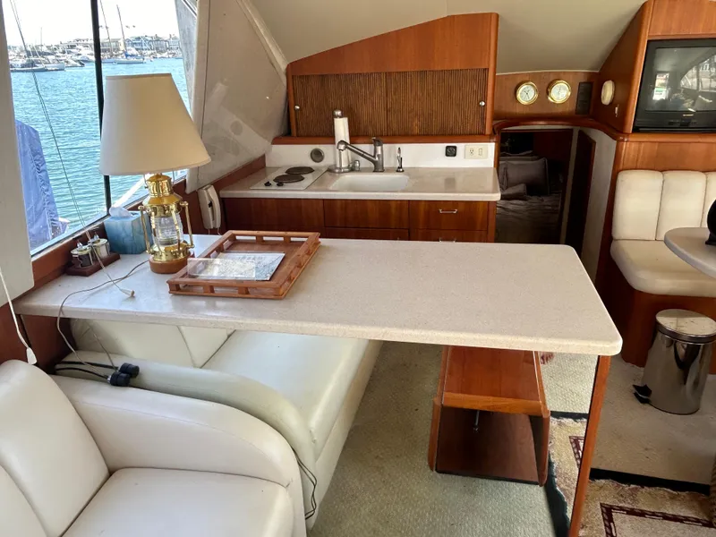 Slide: The Image of Interior of 1995 Ocean Yachts 42 Super Sport with kitchen and seating area. - 26