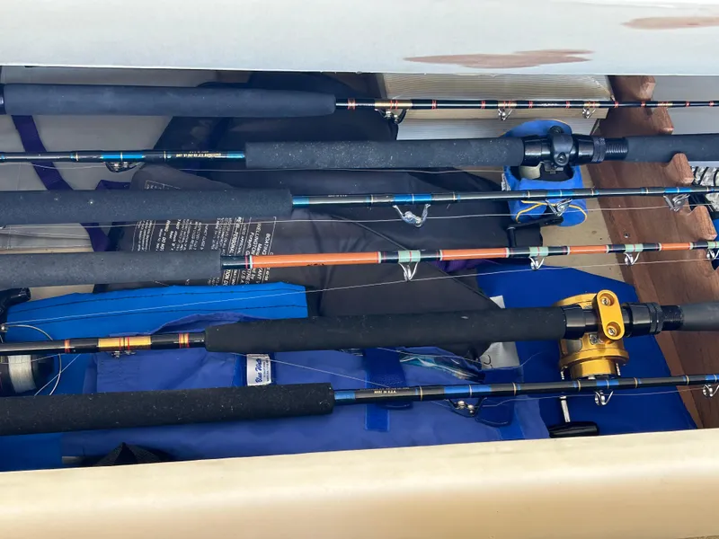 Slide: The Image of Fishing rods stored on a 1995 Ocean Yachts 42 Super Sport boat. - 29