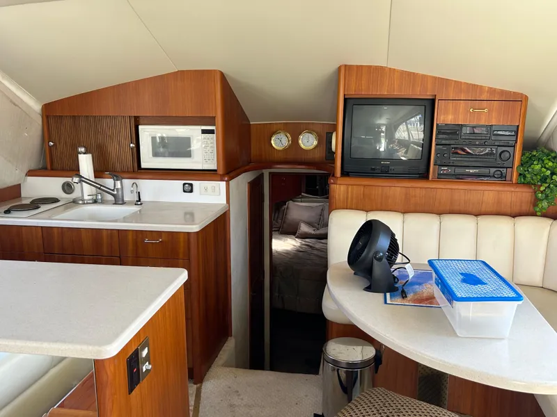 Slide: The Image of Interior of 1995 Ocean Yachts 42 Super Sport with kitchen and seating area. - 34