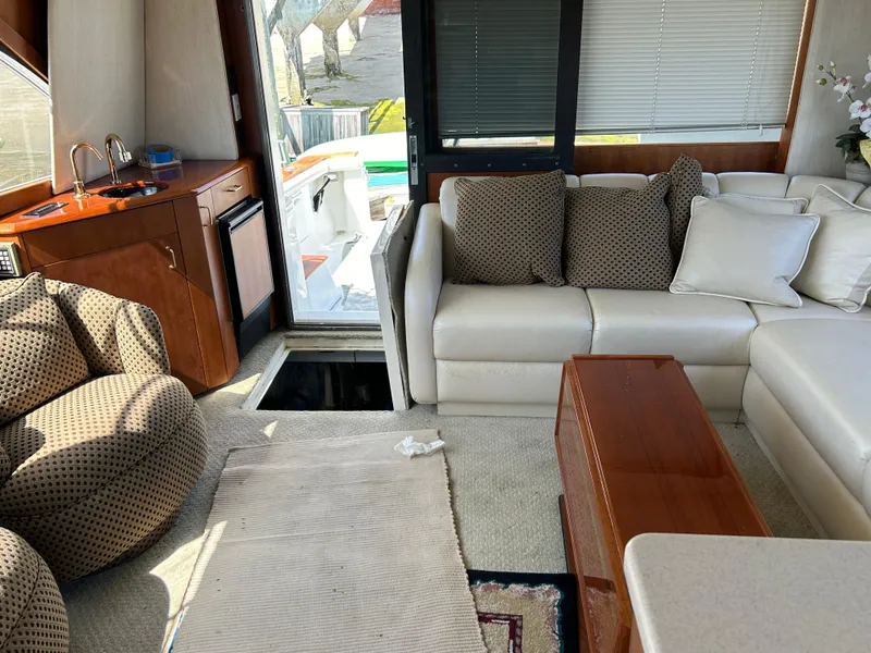 Slide: The Image of Luxurious interior of a 1995 Ocean Yachts 42 Super Sport with plush seating and elegant decor. - 35