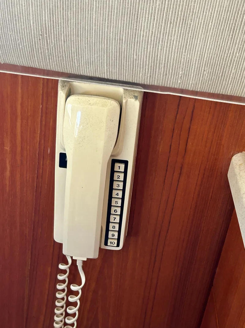 Slide: The Image of Wall-mounted vintage phone on 1995 Ocean Yachts 42 Super Sport. - 37