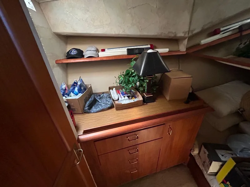 Slide: The Image of Interior of 1995 Ocean Yachts 42 Super Sport with wooden cabinetry and decor items. - 48