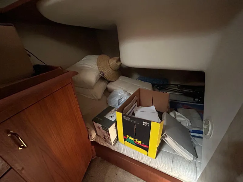 Slide: The Image of Interior cabin of 1995 Ocean Yachts 42 Super Sport with storage items and wooden cabinetry. - 49