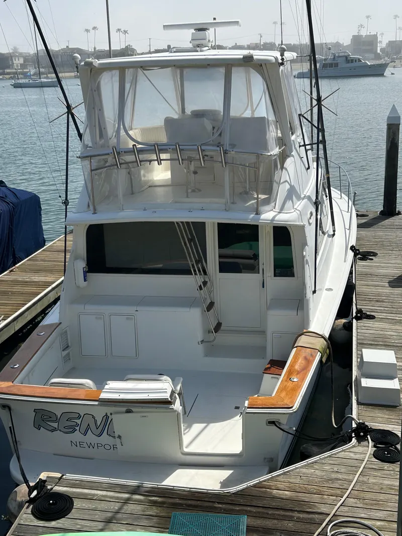 Slide: The Image of 1995 Ocean Yachts 42 Super Sport docked at marina, rear view. - 6