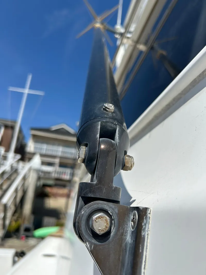 Slide: The Image of Close-up of a 1995 Ocean Yachts 42 Super Sport boat detail with clear blue sky. - 8