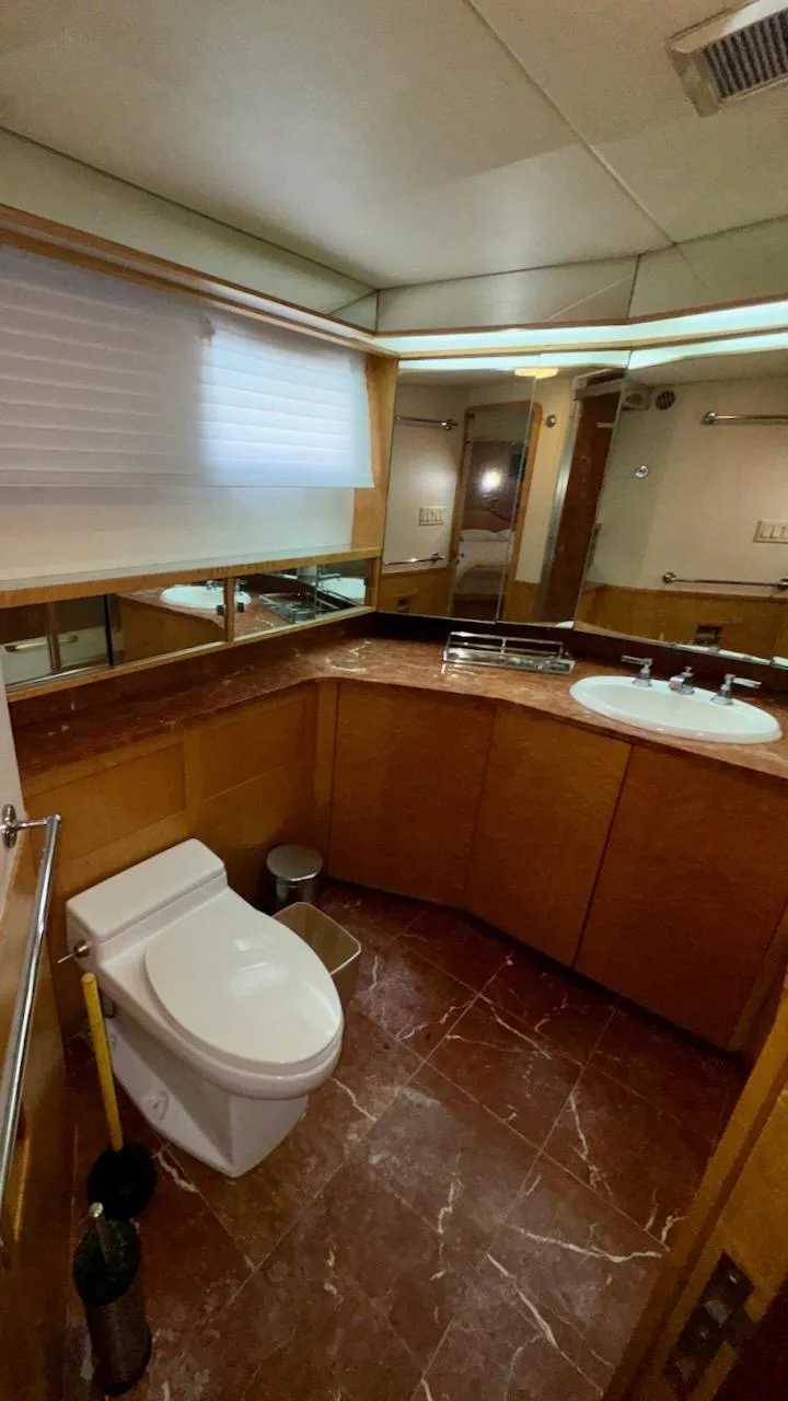 Slide: The Image of Luxurious bathroom in 1987 Burger 86 Raised Pilothouse yacht with marble flooring and modern fixtures. - 24