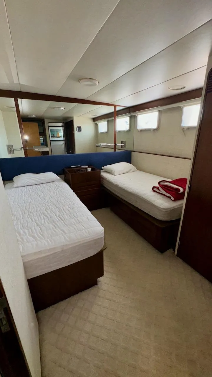 Slide: The Image of Twin beds in a cozy cabin of a 1987 Burger 86 Raised Pilothouse yacht. - 25