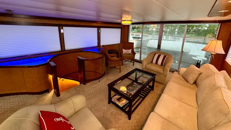 Slide: The Image of Luxurious interior of 1987 Burger 86 Raised Pilothouse yacht with elegant seating and glass table. - 28
