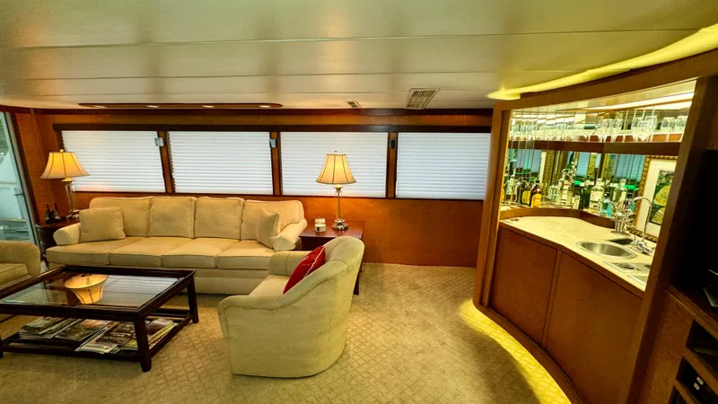 Slide: The Image of Luxurious interior of 1987 Burger 86 Raised Pilothouse yacht with elegant seating and bar area. - 30