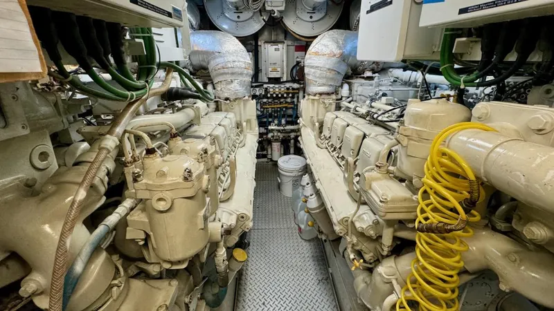 Slide: The Image of Engine room of a 1987 Burger 86 Raised Pilothouse yacht, showcasing machinery and equipment. - 32