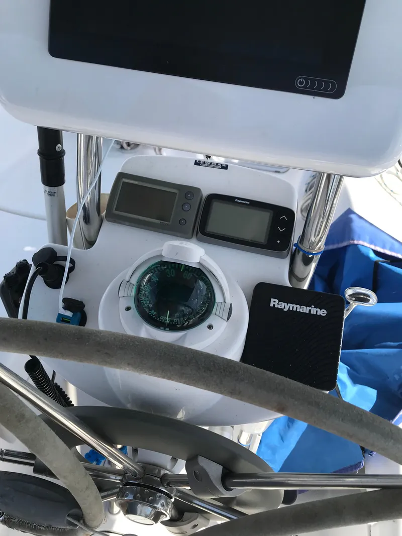 Slide: The Image of 2009 Hunter 310 yacht cockpit with navigation instruments and Raymarine equipment. - 13