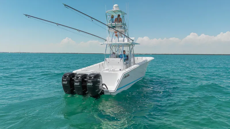 The Image of 2017 SeaHunter 35 Tournament boat with triple engines on clear blue water. - 0