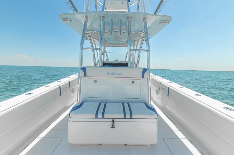 Slide: The Image of 2017 SeaHunter 35 Tournament boat interior with blue and white seating, ocean view. - 12