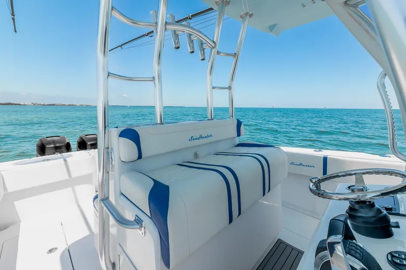 Slide: The Image of 2017 SeaHunter 35 Tournament boat interior with blue and white seating, ocean view. - 15