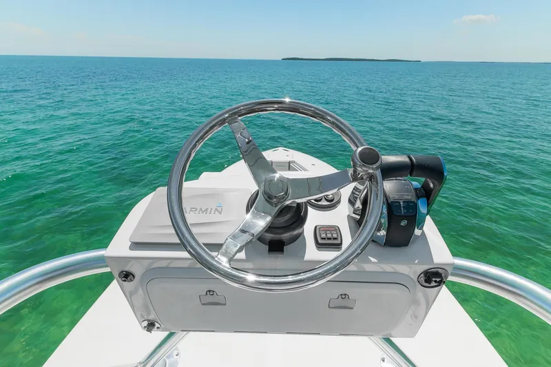 Slide: The Image of Steering console of 2017 SeaHunter 35 Tournament boat on clear blue ocean. - 17