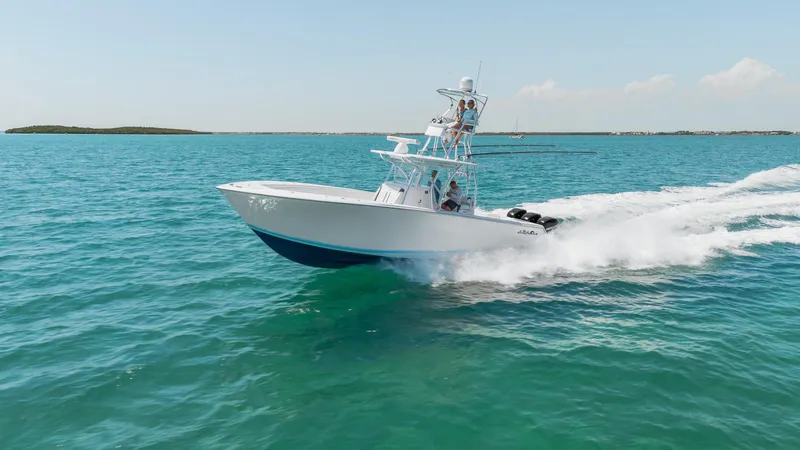 Slide: The Image of 2017 SeaHunter 35 Tournament boat speeding on clear blue ocean waters. - 2