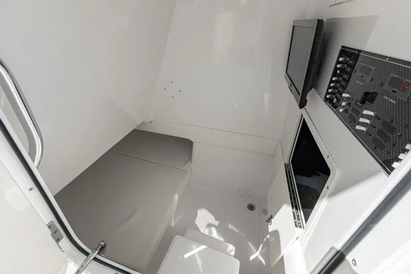 Slide: The Image of Interior cabin of 2017 SeaHunter 35 Tournament boat with control panel and seating. - 20