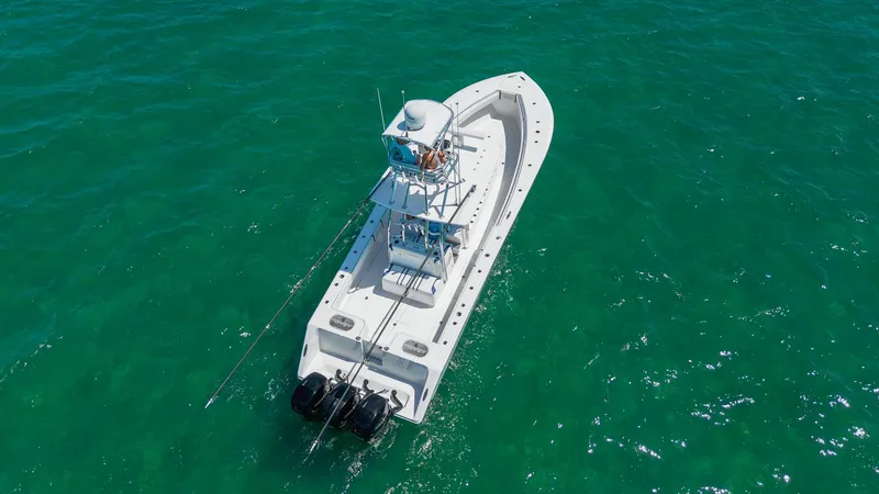 Slide: The Image of 2017 SeaHunter 35 Tournament boat on clear turquoise water, aerial view. - 4
