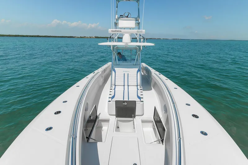 Slide: The Image of 2017 SeaHunter 35 Tournament boat on open water, showcasing sleek design and spacious deck. - 6
