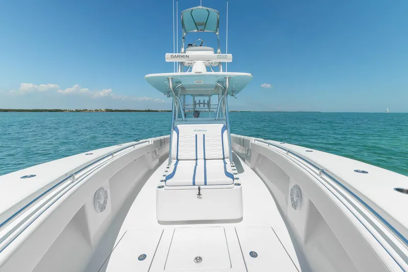 Slide: The Image of 2017 SeaHunter 35 Tournament boat on open water, clear sky, and spacious deck. - 7