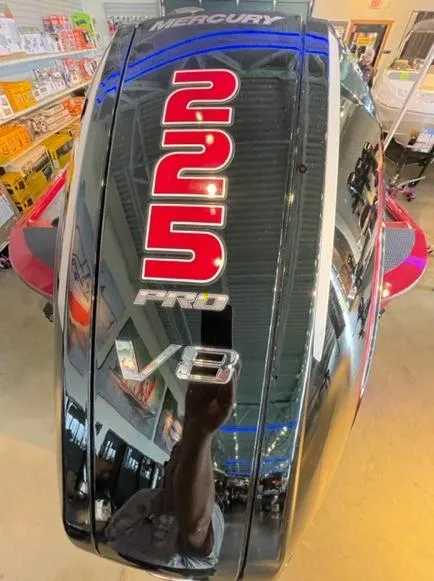 Slide: The Image of Mercury 225 Pro V8 engine on 2025 Tracker Savage 215 boat in showroom. - 4