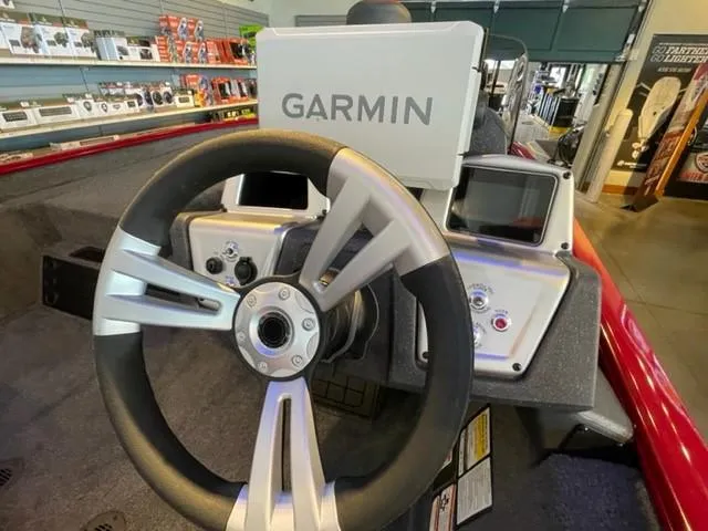 Slide: The Image of Steering wheel of 2025 Tracker Savage 215 with Garmin navigation system. - 6