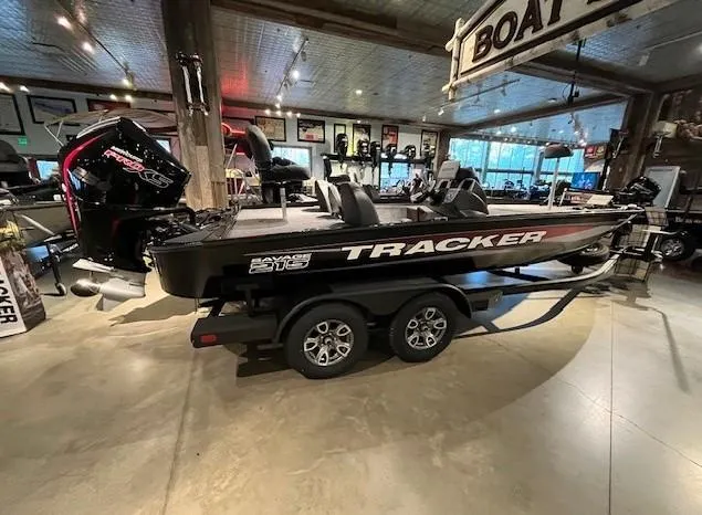 The Image of 2025 Tracker Savage 215 boat displayed indoors on a trailer. - 0