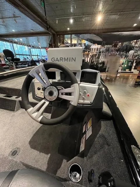 Slide: The Image of 2025 Tracker Savage 215 boat with Minn Kota Ultrex motor in showroom. - 3