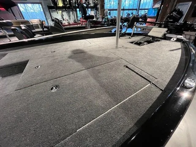 Slide: The Image of Interior of 2025 Tracker Savage 215 boat with modern seating and spacious layout. - 4