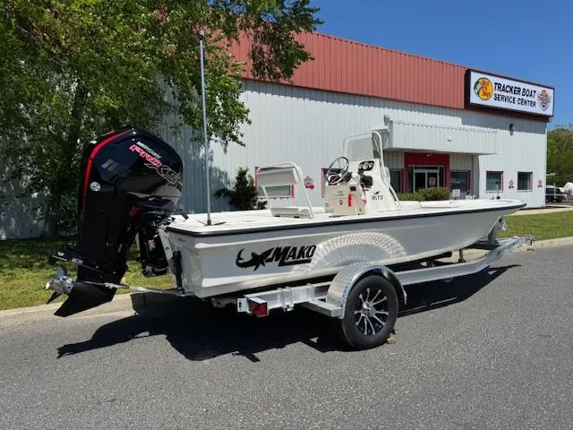 Slide: The Image of 2025 Mako 18 LTS boat on trailer outside Tracker Boat Service Center. - 2