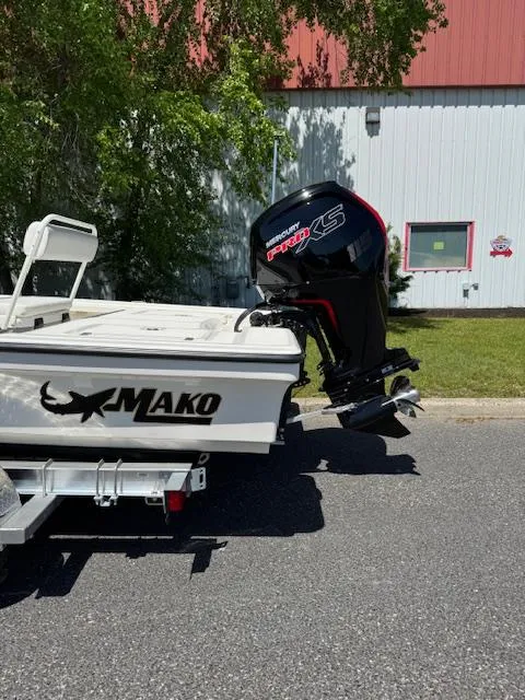 Slide: The Image of 2025 Mako 18 LTS boat with powerful outboard motor, parked outdoors. - 4