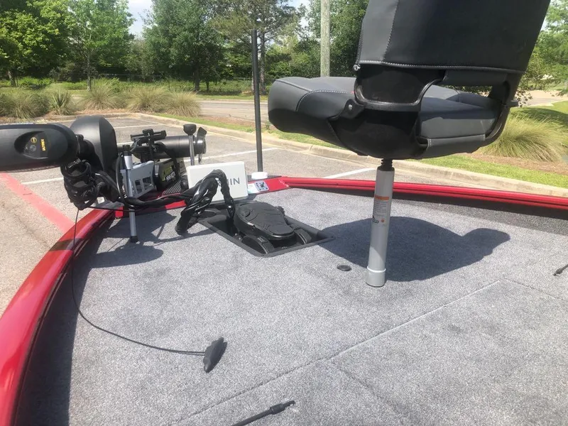 Slide: The Image of 2025 Tracker Savage 215 boat deck with seat and fishing equipment. - 4