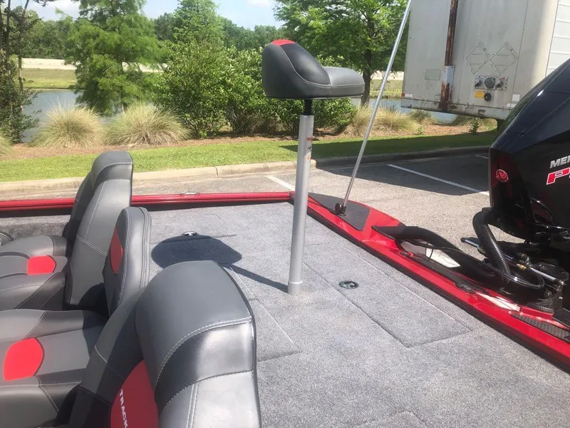 Slide: The Image of 2025 Tracker Savage 215 boat interior with seating and fishing pedestal. - 7