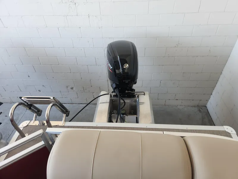 Slide: The Image of 2025 Sun Tracker Party Barge 20 DLX with outboard motor and seating. - 6