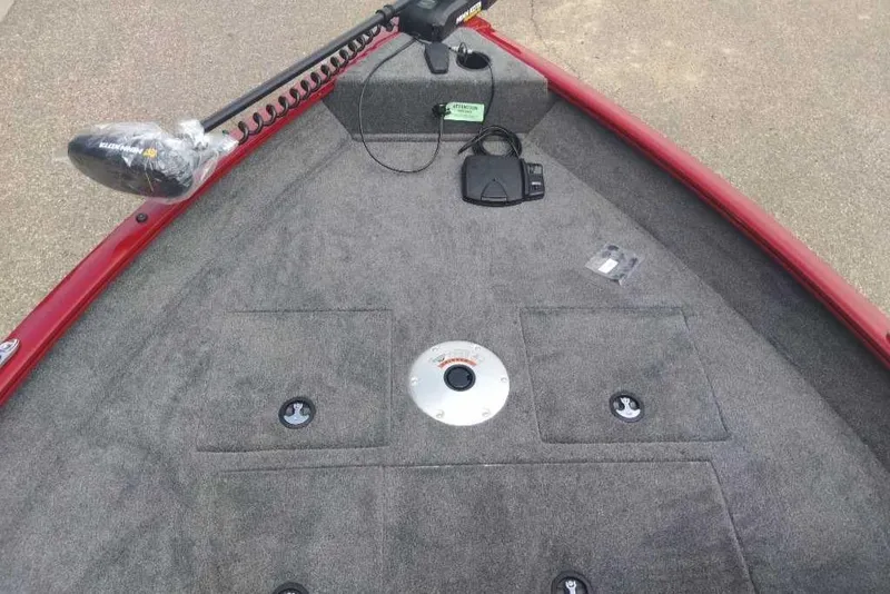 Slide: The Image of 2025 Tracker Pro Guide V-16 SC boat deck with trolling motor and storage compartments. - 2