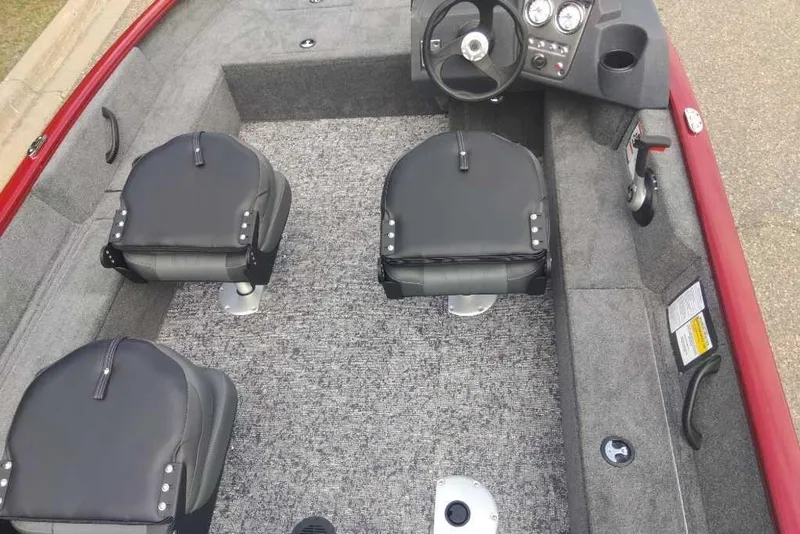 Slide: The Image of Interior of 2025 Tracker Pro Guide V-16 SC boat with seating and steering console. - 3