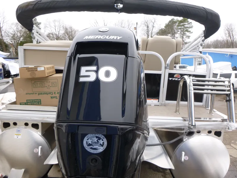 Slide: The Image of 2025 Sun Tracker Party Barge 16 DLX with Mercury 50 engine, rear view. - 4