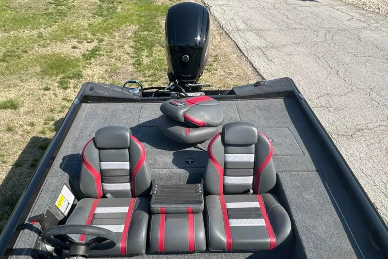 Slide: The Image of 2025 Ranger RT188C boat interior with gray and red seating, viewed from above. - 4