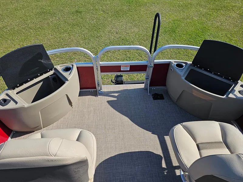 Slide: The Image of 2025 Sun Tracker Bass Buggy 18 DLX pontoon boat interior with seating and storage compartments. - 19