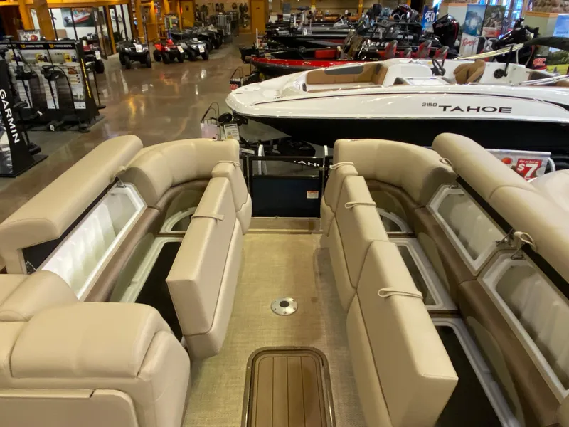 Slide: The Image of Interior view of 2025 Regency 250 DL3 pontoon boat in showroom. - 10